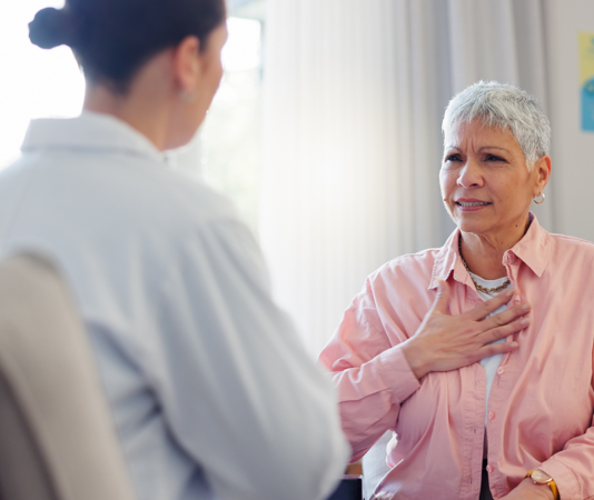 Daughter talking to elderly mother