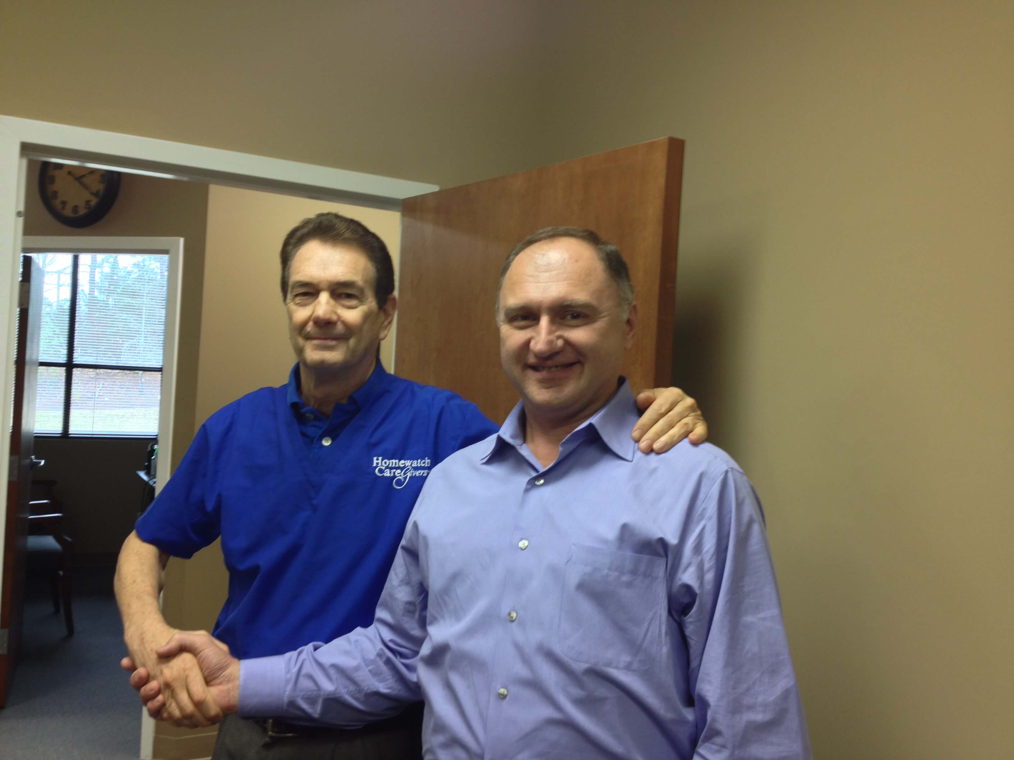 Andy Preston and Homewatch CareGivers franchise owner Anzor Gachechiladze.