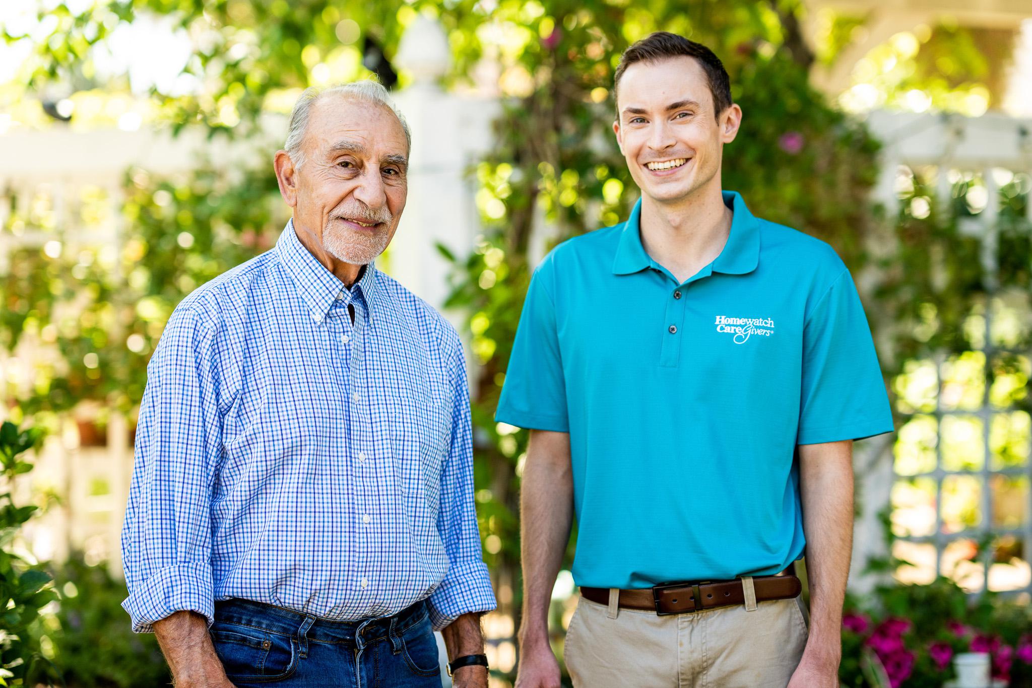 A caregiver standing with a patient