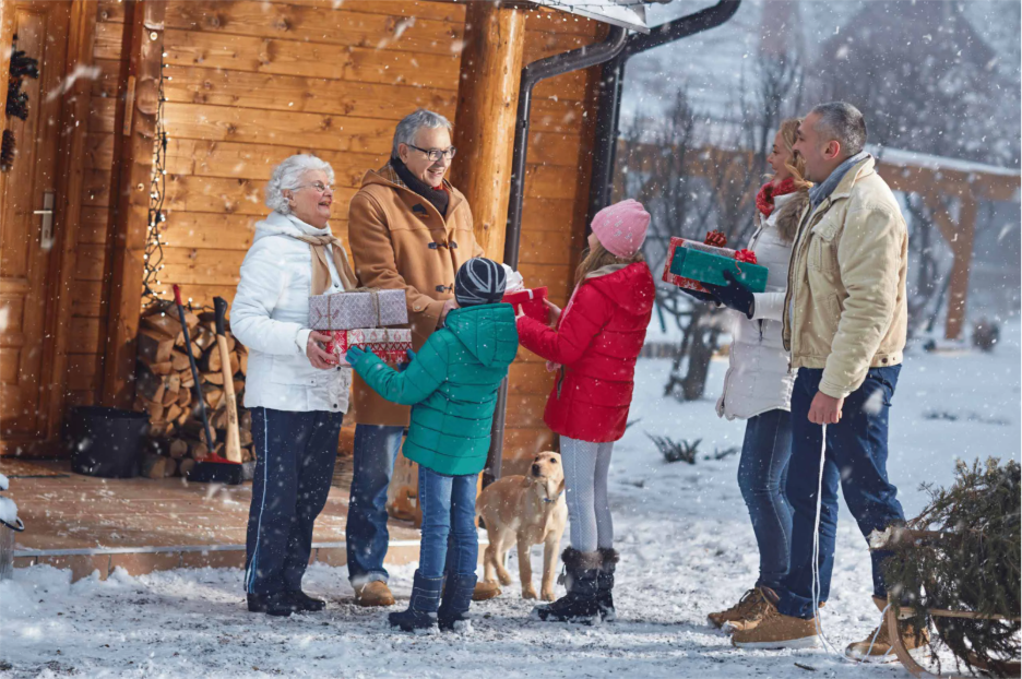 A family smiling together in the snow