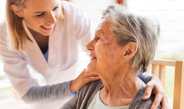 nurse smiling at woman