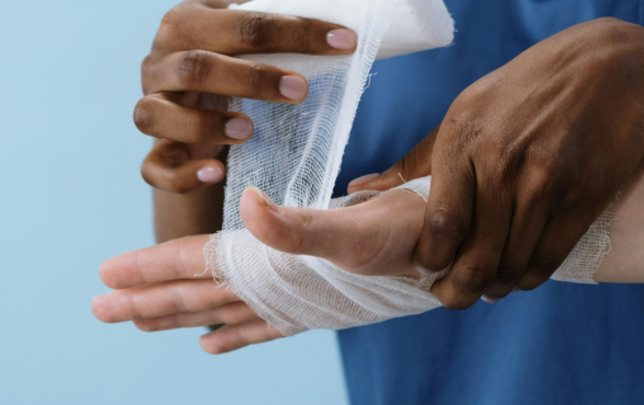 nurse wrapping persons hand