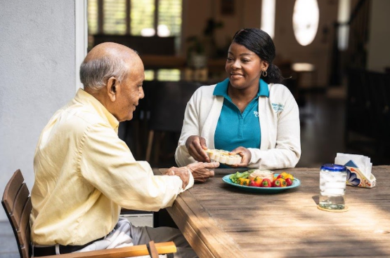 caregiver smiling at man
