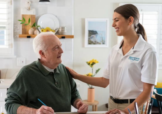 caregiver smiling at man