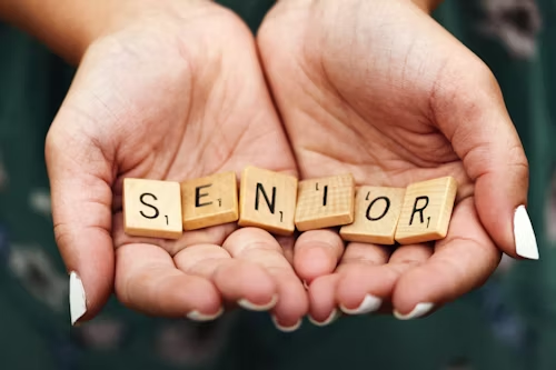Senior spelled using wood letter tiles