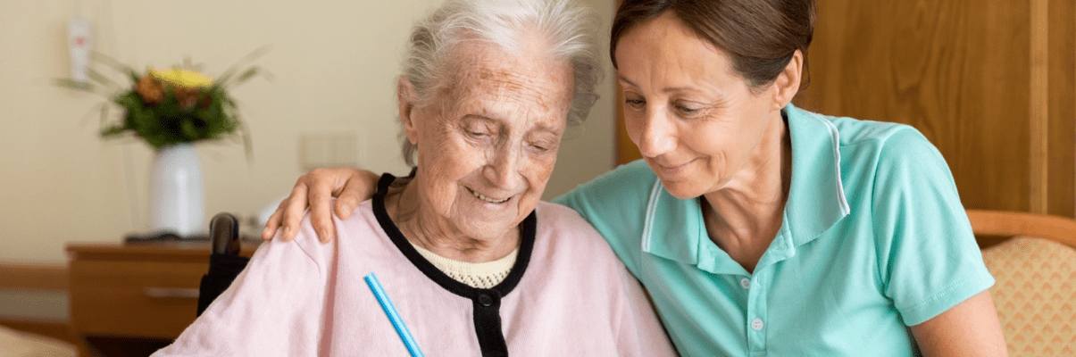 elderly woman with caregiver