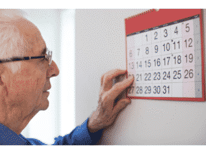 man looking at a calendar