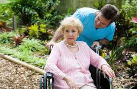 A woman being pushed in a wheel chair