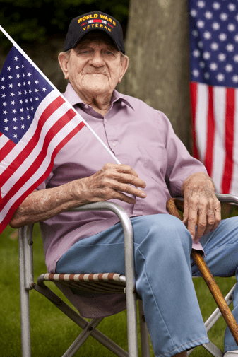 Veteran holding a flag