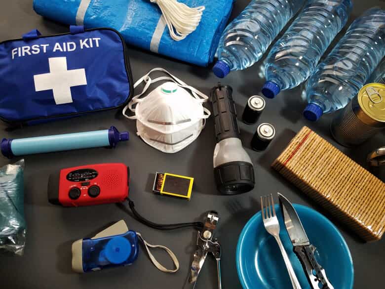 emergency kit, water bottles, mask, flashlight, etc.