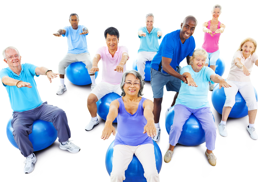 elderly people on exercise balls